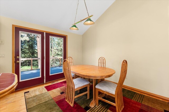 14512 N Dartford Dr, Spokane, WA 99208 - dining room featuring lofted ceiling and light wood-style flooring