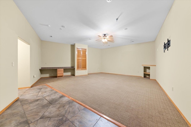 14512 N Dartford Dr, Spokane, WA 99208 - empty room featuring ceiling fan, baseboards, carpet flooring, and a desk