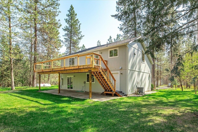 14512 N Dartford Dr, Spokane, WA 99208 - rear view of house featuring stairway, a deck, a yard, and a patio