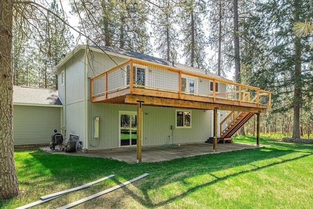 14512 N Dartford Dr, Spokane, WA 99208 - back of house featuring a patio, a wooden deck, a yard, and stairs