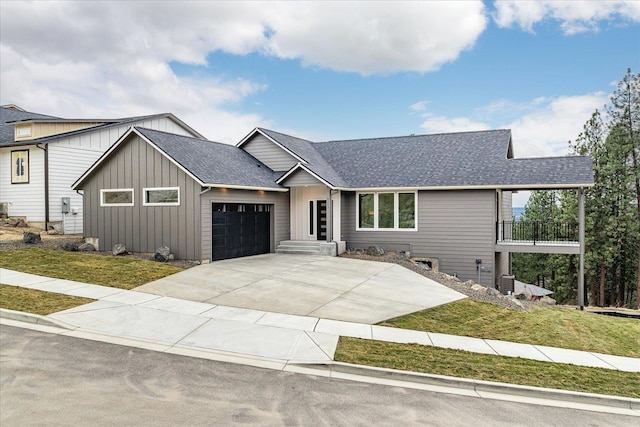 4243 W Tolliver Ct, Spokane, WA 99208 - view of front of property featuring a garage, board and batten siding, a shingled roof, and a front lawn