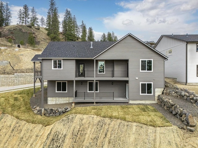 4243 W Tolliver Ct, Spokane, WA 99208 - rear view of house featuring a balcony, a patio, and a lawn
