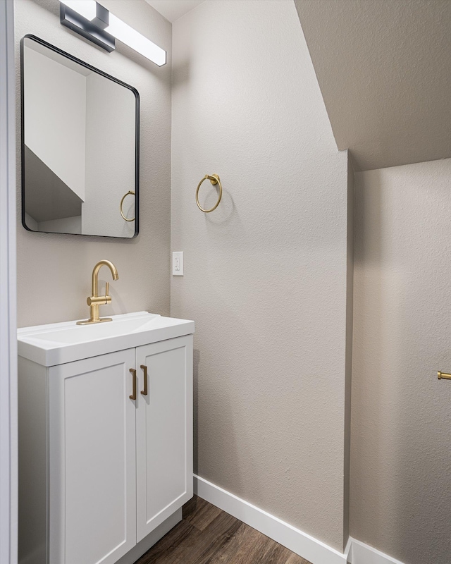 923 E Everett Avenue 921E Everett Ave, Spokane, WA 99212 - bathroom with wood finished floors, baseboards, and vanity