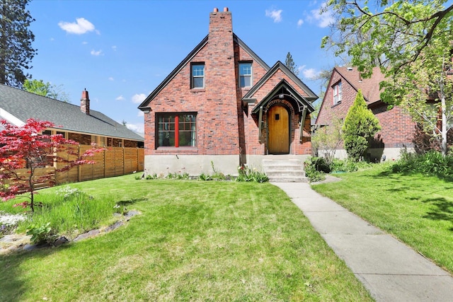 1308 W 11th Ave, Spokane, WA 99204 - tudor-style house with brick siding and a chimney