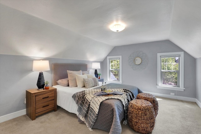 1308 W 11th Ave, Spokane, WA 99204 - bedroom featuring light colored carpet, vaulted ceiling, and baseboards