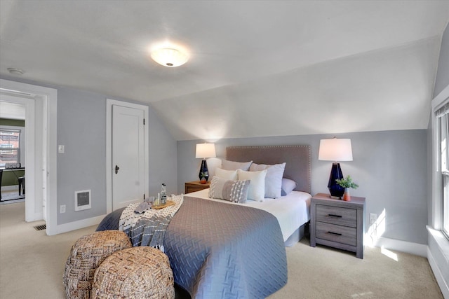 1308 W 11th Ave, Spokane, WA 99204 - carpeted bedroom featuring baseboards, lofted ceiling, and heating unit