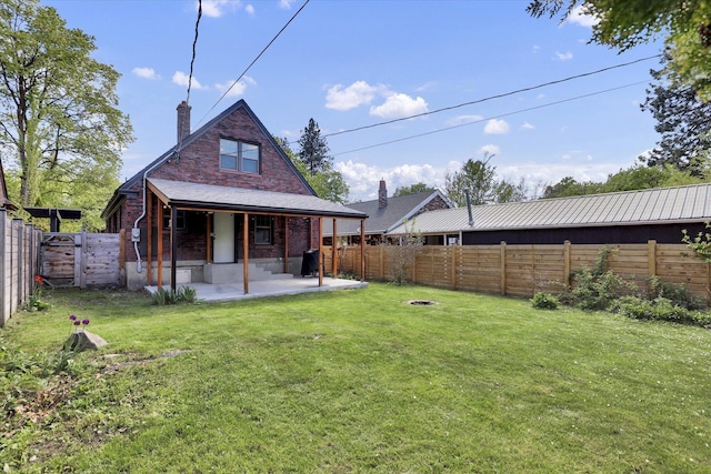 1308 W 11th Ave, Spokane, WA 99204 - rear view of house with a chimney, a patio area, and brick siding