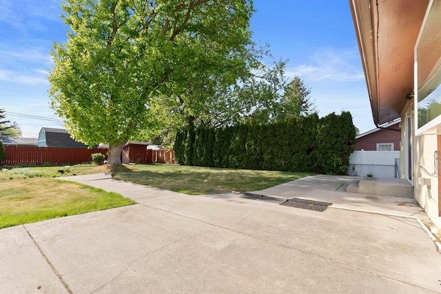 view of patio featuring an outbuilding and a storage shed