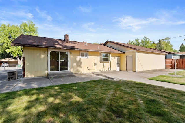 back of property featuring a patio area, entry steps, a chimney, and cooling unit