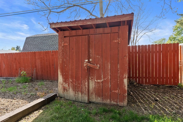view of shed with fence