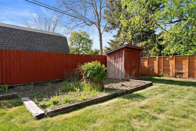 view of yard with a shed and an outbuilding