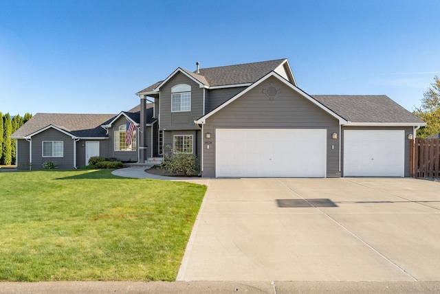 traditional-style home with a garage, concrete driveway, and roof with shingles