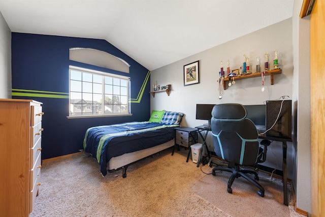 bedroom with carpet flooring, lofted ceiling, and an office area