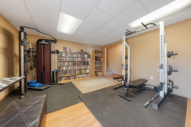 exercise room featuring a drop ceiling