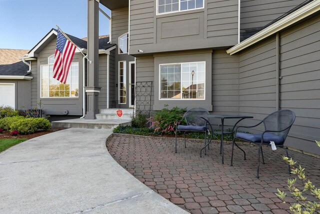 entrance to property with a patio area