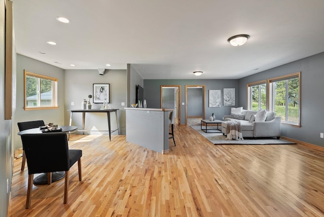 18707 E Terrapin Ln, Otis Orchards, WA 99027 - living area featuring light wood finished floors, plenty of natural light, recessed lighting, and baseboards