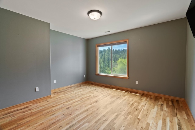 18707 E Terrapin Ln, Otis Orchards, WA 99027 - spare room featuring wood finished floors and baseboards