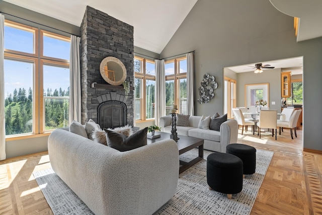 18707 E Terrapin Ln, Otis Orchards, WA 99027 - living area with a stone fireplace, high vaulted ceiling, ceiling fan, and baseboards