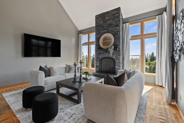 18707 E Terrapin Ln, Otis Orchards, WA 99027 - living area with plenty of natural light, a stone fireplace, baseboards, and high vaulted ceiling