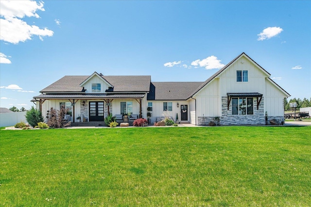 15921 W Four Mound Rd, Nine Mile Falls, WA 99026 - view of front facade with board and batten siding, stone siding, and french doors