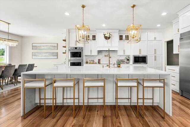 15921 W Four Mound Rd, Nine Mile Falls, WA 99026 - dining space with a chandelier, light wood finished floors, and recessed lighting