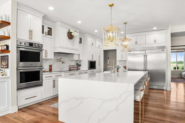 15921 W Four Mound Rd, Nine Mile Falls, WA 99026 - indoor wet bar featuring wine cooler, recessed lighting, tasteful backsplash, appliances with stainless steel finishes, and light wood-style floors