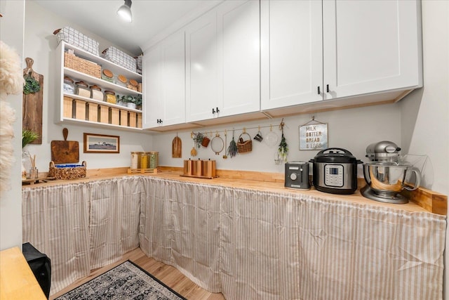 15921 W Four Mound Rd, Nine Mile Falls, WA 99026 - kitchen with a sink, a chandelier, white cabinetry, recessed lighting, and light wood-style floors