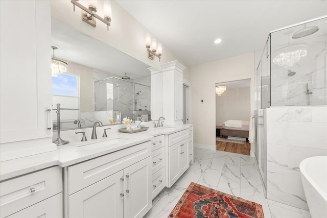 15921 W Four Mound Rd, Nine Mile Falls, WA 99026 - bedroom with a barn door, baseboards, wood finished floors, a chandelier, and recessed lighting