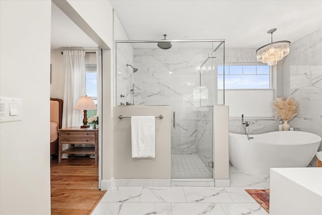 15921 W Four Mound Rd, Nine Mile Falls, WA 99026 - bedroom with light wood-type flooring, a chandelier, and baseboards
