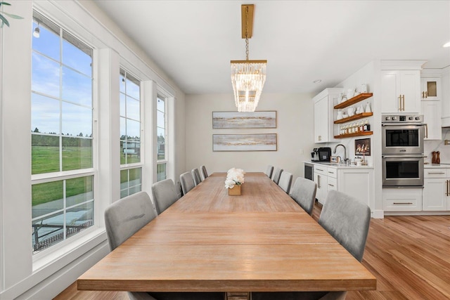 15921 W Four Mound Rd, Nine Mile Falls, WA 99026 - living room featuring a chandelier, high vaulted ceiling, wood finished floors, and recessed lighting