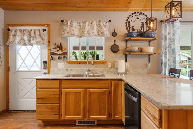 kitchen featuring a sink, dishwasher, open shelves, light wood-style flooring, and light stone countertops