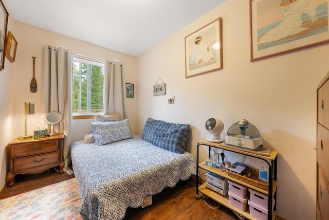 bedroom with wood finished floors