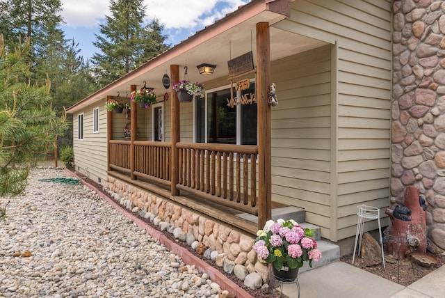 view of side of home featuring a porch