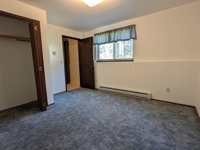 unfurnished bedroom with baseboard heating and carpet