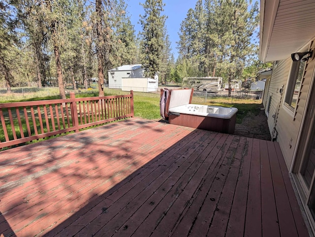 wooden deck with a hot tub