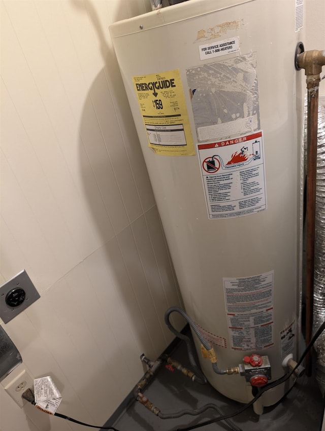 utility room with gas water heater