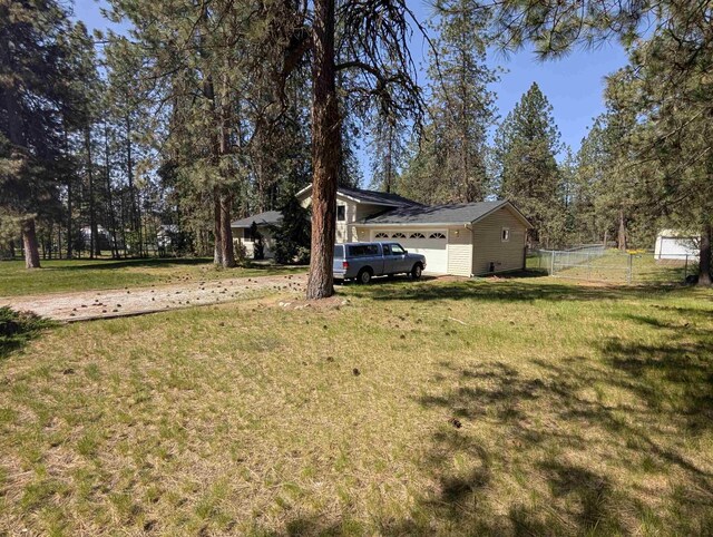 view of yard with a garage