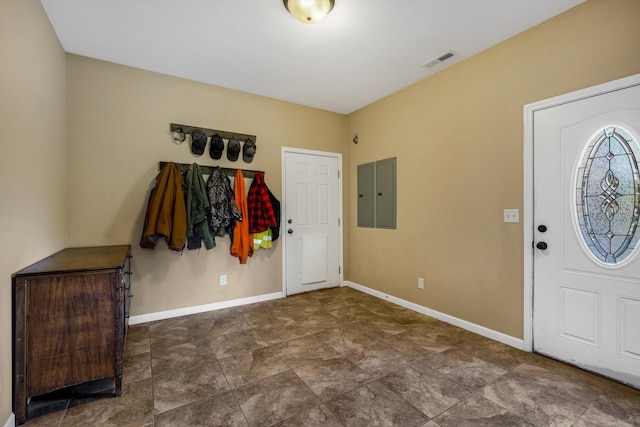 entryway with electric panel and baseboards