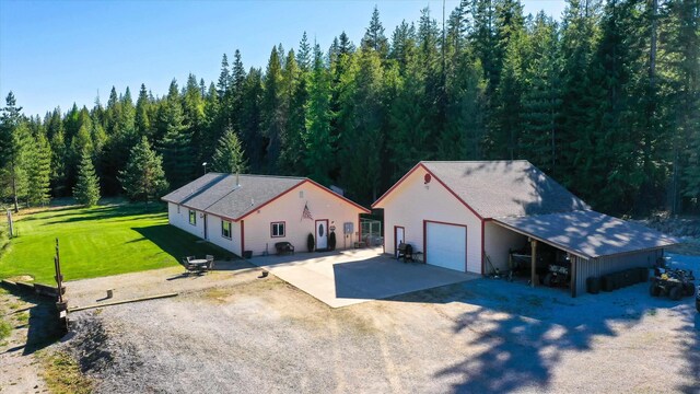 view from above of property featuring a forest