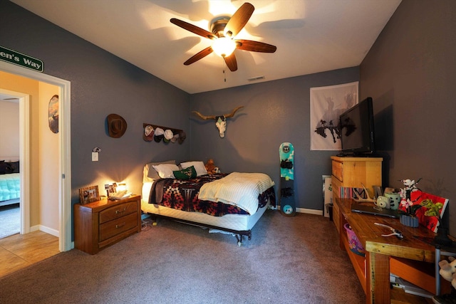 carpeted bedroom with lofted ceiling and a ceiling fan