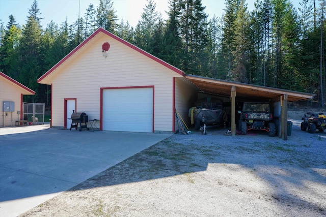 garage with concrete driveway and a garage