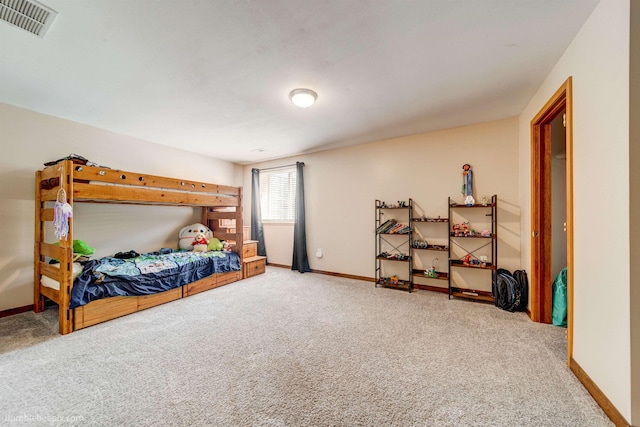 carpeted bedroom featuring baseboards