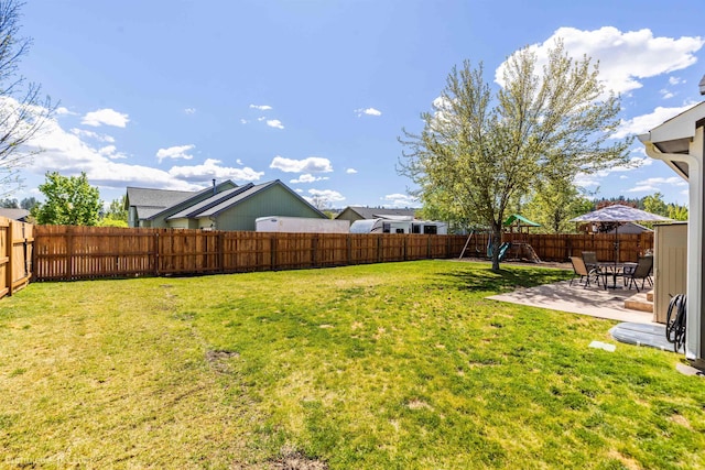 view of yard with a playground and a patio