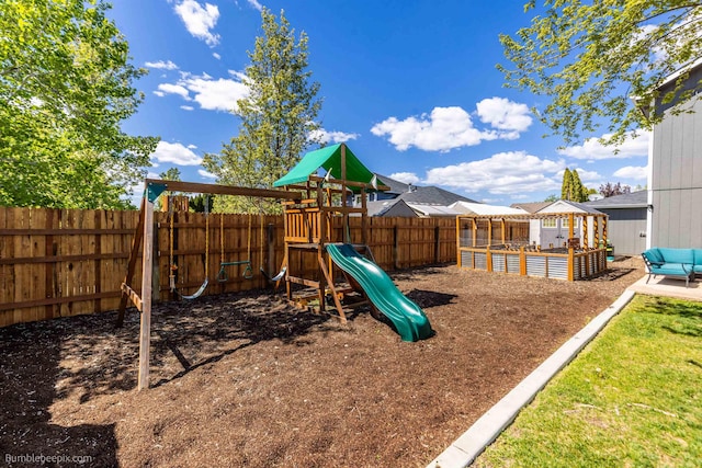 view of play area with a fenced backyard