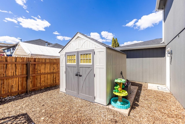 view of shed with a fenced backyard