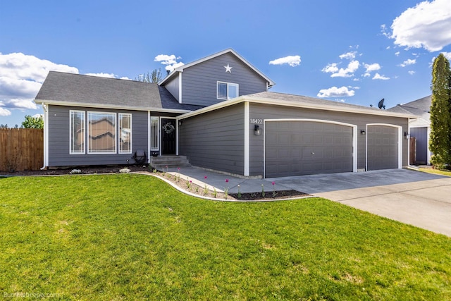traditional home featuring concrete driveway and an attached garage