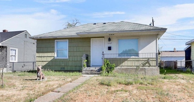 1207 E Garland Ave, Spokane, WA 99207 - bungalow-style house with a shingled roof and fence