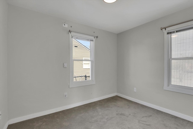 1207 E Garland Ave, Spokane, WA 99207 - carpeted empty room with baseboards