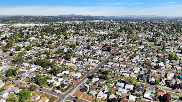 1207 E Garland Ave, Spokane, WA 99207 - aerial overview of property's location with a mountain backdrop