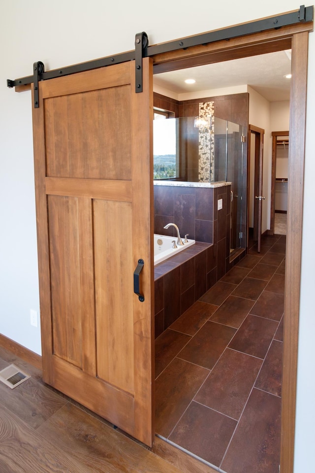 60874 Westview Dr, Nine Mile Falls, WA 99026 - bathroom with a shower stall, a bath, baseboards, and a spacious closet
